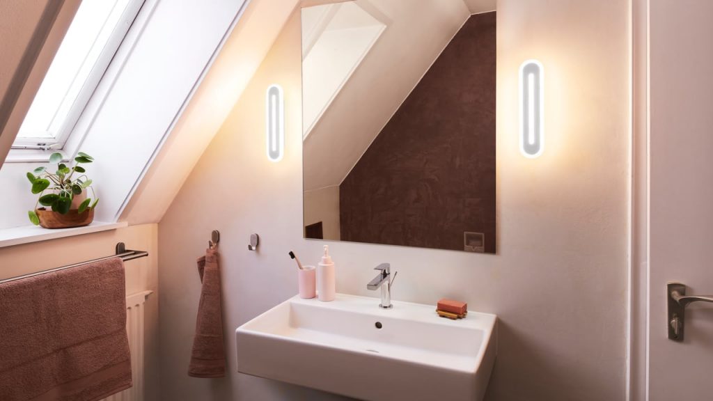 Two Ledvance luminaires from the Orbis Bath series above a washbasin.